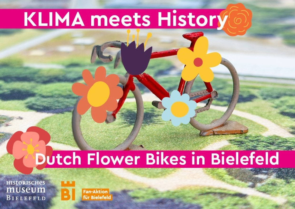 Buntes Blumenfahrrad in einer Landschaft